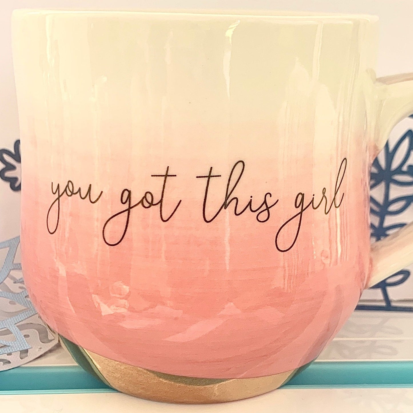 Pink ombre mug with Gold handle and bottom with the words in cursive You Got This Girl